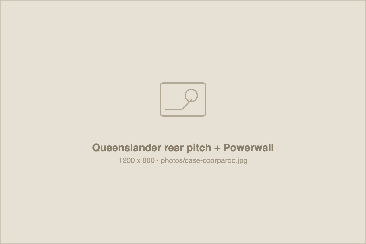 Solar panels on the rear pitch of a Coorparoo Queenslander, hidden from the street.